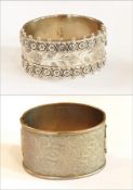 Victorian silver bangle with applied and engraved floral decoration together with another bangle