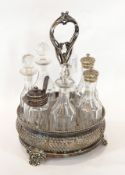An EPNS condiment set comprising cut glass bottles,
