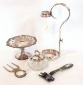 A cut glass and silver lidded jam pot, a silver plate wine bottle holder, adjustable,