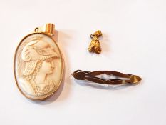 A carved shell cameo pendant with portrait of Hermes, oval, in gold-coloured mount,