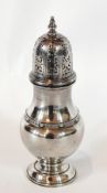 A George VI silver sugar caster, the bulbous body with Celtic design border,