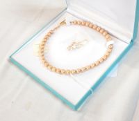 Necklace and earring set made from champagne coloured cultured pearls (dyed),