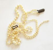 Double string of graduated cultured pearls on marcasite set clasp