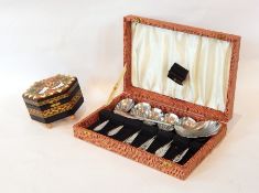 A stainless steel dessert set, boxed, comprising spoons and serving spoon,