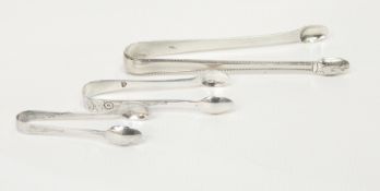 Pair Georgian silver sugar tongs with beaded borders and two smaller pairs of silver sugar tongs