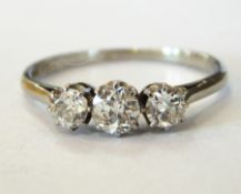Platinum and 18ct gold three-stone diamond ring, the three stones approx. total 0.