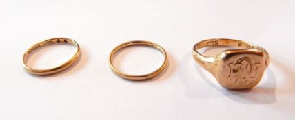 A 9ct gold signet ring, monogram engraved, a 9ct gold wedding band and another (marks rubbed),