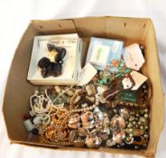 An assortment of costume jewellery including necklaces, brooches etc.