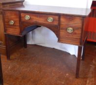 A Georgian style mahogany sideboard, with frieze drawer, flanked by deep cupboard and drawer,