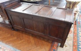 Early 18th century oak coffer, the four panel top above a plain frieze,