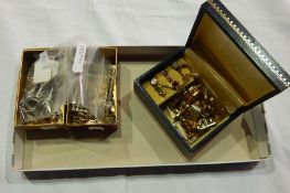 Gold coloured metal earrings, cufflinks, decorative synthetic pearl and flowerhead necklace, etc.