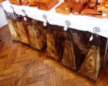 Six Moroccan wrought metal and goatskin lampshades of henna design