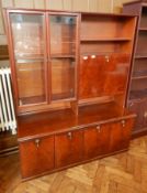 A modern mahogany cabinet with glazed cupboard and drop front cocktail cabinet with pair of