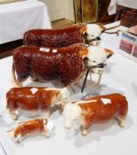 A pair of large Herefordshire bulls with nose rings and head collar and a Coppercraft ceramic