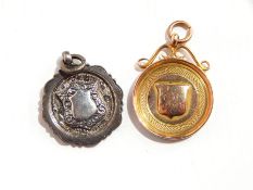 A 9ct gold fob with presentation inscription 