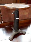 A cast iron Singer stool,