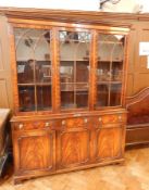 A Bevan Funnell gothic-style mahogany reproduction library bookcase, three-section with dentil,