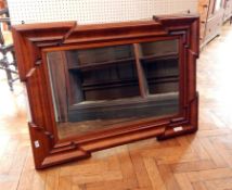 A mahogany rectangular mirror with squared corners,