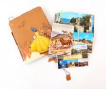 A quantity of postcards including album dated 1942 containing postcards of naval war ships,