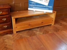 A 20th century inlaid oak low sideboard with undershelf and three short drawers, on block supports,