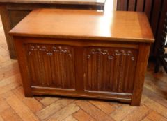 An oak coffer with linenfold decoration,