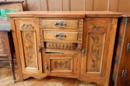 A Victorian walnut breakfront sideboard with two flanking cupboards and two drawers and under