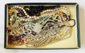 A large quantity of costume jewellery necklaces including beads, simulated pearls, etc.
