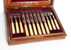 A set of six silver fish knives and forks with ivorine handles, London 1895,