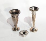 A small silver trumpet-shaped flower vase, Birmingham 1969 together with another,