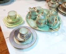 A porcelain early morning tea service of eight pieces viz:- teapot, sugar bowl, cream jug,
