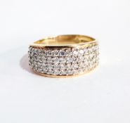 A 14ct gold and diamond dress ring set four rows of approximately 15 claw set stones