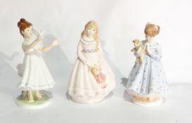 Three Royal Worcester china figures of children 