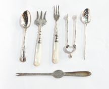 A collection of silver to include a lobster fork, pickle fork, bread fork,