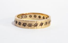 A 9ct gold eternity ring set white stones and a loose small brilliant cut diamond