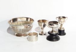 A George V silver circular bowl of half-reeded design, raised on a circular foot, Chester 1919,