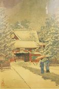 Oriental print of women with parasols in the snow, outside building,
