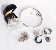 A seedpearl and black enamel ring, pair silver Celtic knot-pattern earrings,