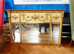 A rectangular gilt Regency style mirror with urn and swag decoration, with 