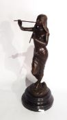 Bronze figure of semi-draped female playing pan-pipes, having foundary stamp,