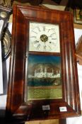 An American mahogany cased wall clock by E N Welch, 30-hour striking movement, enamel dial,