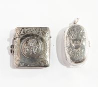 A silver vesta case depicting golfers, Birmingham 1904 together with an oval silver sovereign case,