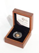 A Royal Mint 2009 UK quarter-sovereign,