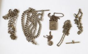 A heavy silver curb link watch chain with T-bar,