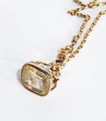 19th century gold coloured metal seal with citrine coloured stone with scroll mount,