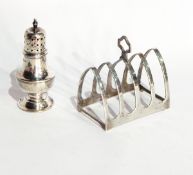 A silver four-division lancet-shaped toast rack with a pepperpot and a caddy spoon and a set of six