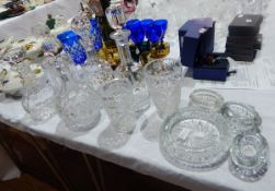 Quantity of cut glassware to include decanters, ashtrays, vases, etc.