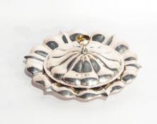 A William IV dish and cover of petal form, the finial in the form of a buttercup, London 1834,