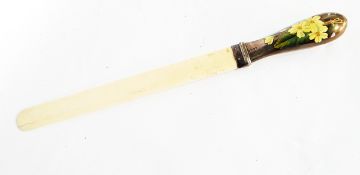 A Victorian ivory letter knife with silver and floral enamelled handle, London 1886,