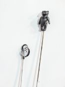A silver-topped hat pin by Charles Horner and another with hinged teddy bear finial