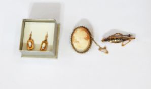 A 9ct gold and white stone leaf brooch, the unfold leaf revealing five white stones,